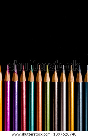 Set beautiful black, colored pencils of colored pencils on black background. Soon to school. Back to School