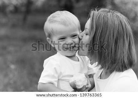 Mother kissing the son