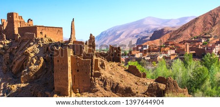 Amazing view of a Kasbah's ruin on the way to Kasbah Ait Ben Haddou near Ouarzazate in the Atlas Mountains of Morocco. Artistic picture. Beauty world. Royalty-Free Stock Photo #1397644904