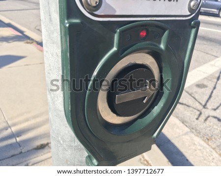 Sidewalk crosswalk arrow button for pedestrians