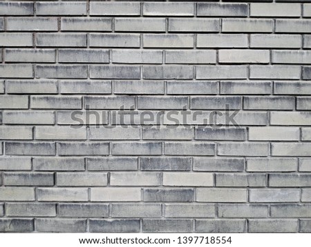 Gray outdoor building facade wall. Brickwork texture