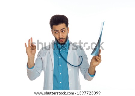  doctor with a stethoscope holding x-ray fingers sign on an isolated background                             