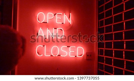 Open And Closed sign in a local shop