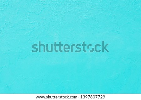 Bright blue cement wall texture for background.