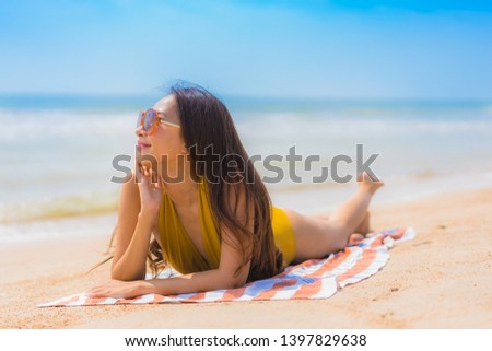 Portrait beautiful young asian woman smile happy and leisure on the beach and sea for vacation travel concept