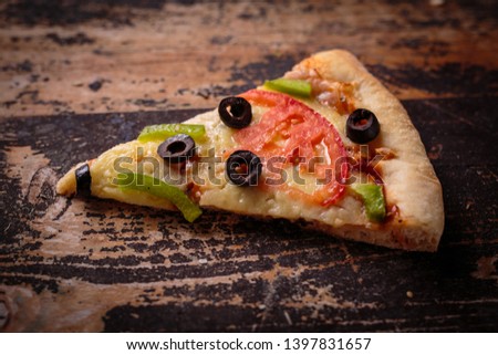 Pizza on a wooden board.