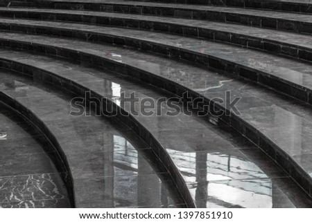 Gray, bright circular marble staircase 