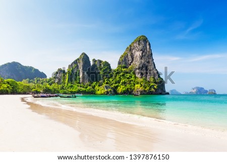 Thai traditional wooden longtail boat and beautiful sand Railay Beach in Krabi province. Ao Nang, Thailand. Royalty-Free Stock Photo #1397876150