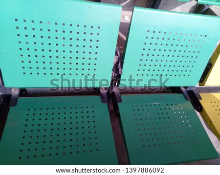 Close up green iron seat. view of stadium with empty seat. Colorful seat in soccer stadium when holiday.  
