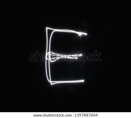 E-created by light letters - uppercase character, Pictured by light letters, painted by light, Black background light font,​selective​ focus