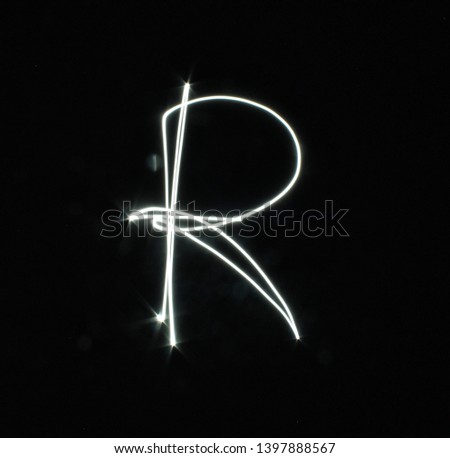 R-created by light letters - uppercase character, Pictured by light letters, painted by light, Black background light font,​selective​ focus