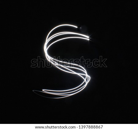 S-created by light letters - uppercase character, Pictured by light letters, painted by light, Black background light font,​selective​ focus