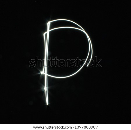 P-created by light letters - uppercase character, Pictured by light letters, painted by light, Black background light font,​selective​ focus