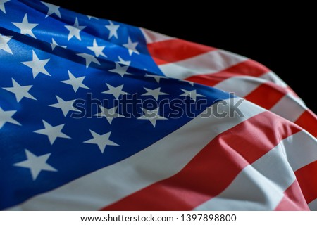 USA American flag waving on black background.