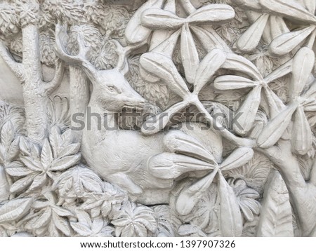 Low relief cement Thai style handcraft of flower stucco.