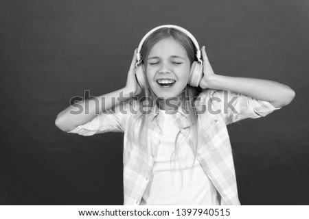 Music always with me. Little girl listen song headphones. Online radio station channel. Leisure concept. Girl child listen music modern headphones. Get music account subscription. Enjoy music concept.