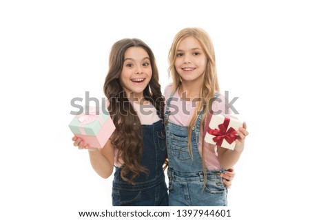 Girls open holiday present. Children cheerful hold presents. Opening gifts. Perfect present for teens. Shopping day. Birthday present. For my dear friend. Girls sisters or friends hold gift boxes.