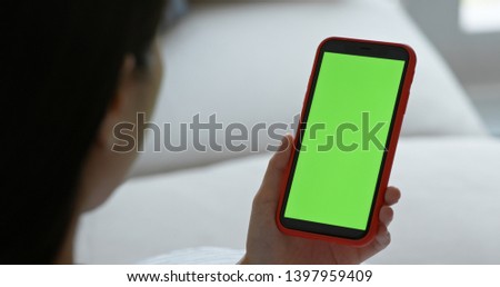 Woman hold with mobile phone with chroma key