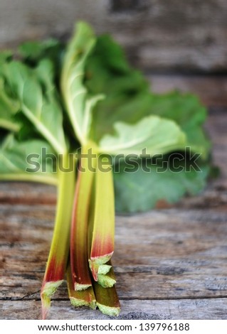 fresh rhubarb on the wooden table