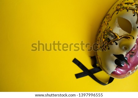 carnival mask on bright color background