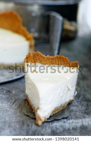 A slice of classic New York cheesecake. Close-up 