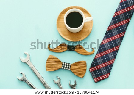 top view photo of gift box, necktie and cup of coffee. Father's day concept