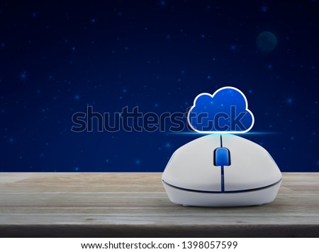 Cloud icon with copy space and wireless computer mouse on wooden table over fantasy night sky and moon, Cloud computing concept
