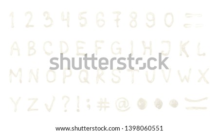 Full set of latin abc alphabet symbols, including numbers and other design elements, made of food sauce, composition isolated over the white background
