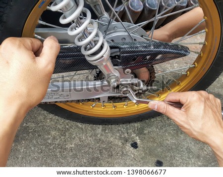Making an adjustment on a motorcycle