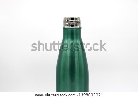 Close up green stainless water bottle isolated on white background.