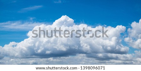 Big cloud in this image composed by merging three photos, natural coloring.
