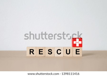 Wood block Stacking with "RESCUE" text and Medical Symbol.