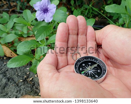 Using compass magnetic energy and feng shui to enhance your life and pointed to north direction for navigation.
