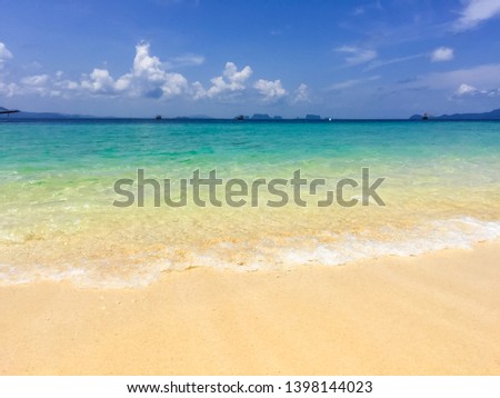 The sea in summer. In the picture you will see the light blue sea, dark blue and dark blue contrasting clearly. Clear sea water until you see the sand beneath clearly You will see small waves that hit