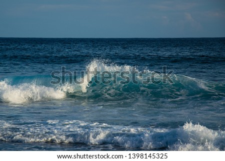 beautiful blue waves from the indian ocean at la reunion island at the shark beach 