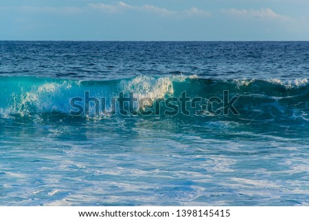 beautiful blue waves from the indian ocean at la reunion island at the shark beach 