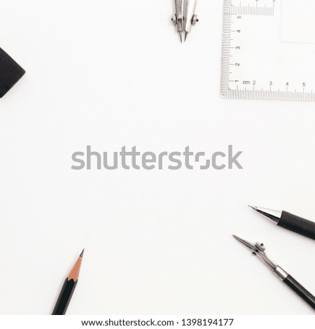 Background with white paper, pencils and eraser. Workplace for the painter. Background to display the logo and lettering. copyspace, space for text. the blogger instrument.