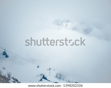 Cable car above the clouds high in the mountains of Krasnaya Polyana in Sochi