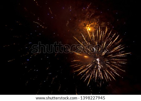 Beautiful sparks from fireworks in the sky at night.