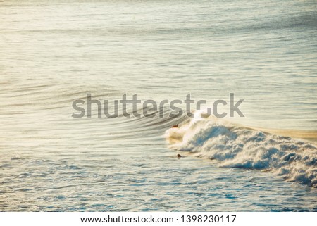 Surfers and Waves at Bells Beach, Australia