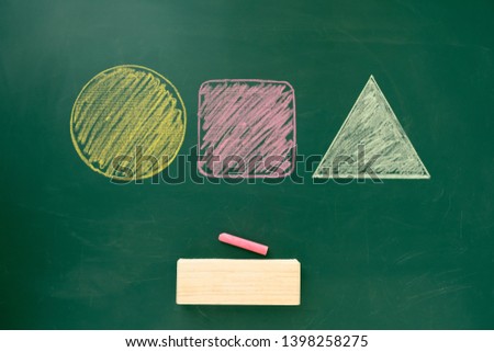 Geometry shapes free hand drawing on chalkboard with eraser- square, triangle, circle