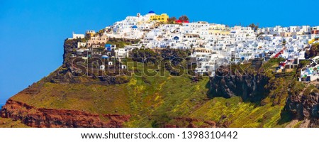 Wide panorama banner of Santorini island, Greece. Imerovigli town village on the top of volcanic rocks with colorful houses