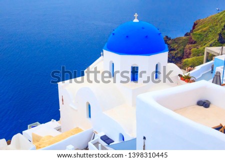 Santorini, Greece, sea and iconic view of blue and white church dome, Oia town village