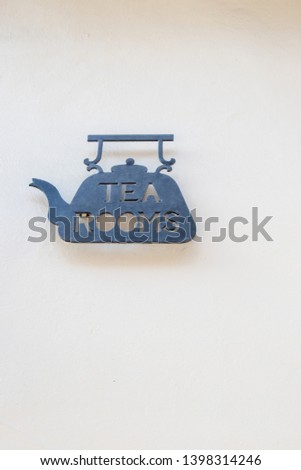 Metal Tea Rooms sign, dark against a white background.  Suitable for cafe or tea shop
