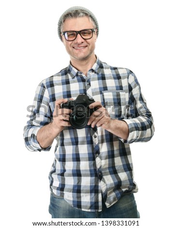 Portrait of handsome mature photographer on white background