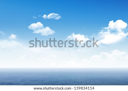Sunny sky with a blue surface of the sea
