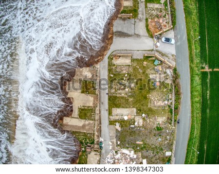 Aerial vision of coastal erosion in the UK Royalty-Free Stock Photo #1398347303