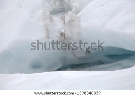 ICE CAVE AND DROPS OF MELTING ICE