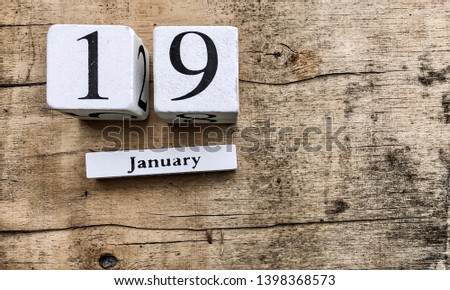 Top view of white wooden calendar showing the date 19 st of January  on wooden old background,Copy space.