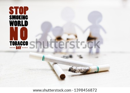 Paper cut of family destroyed by cigarettes. Drugs destroying family concept. Quit smoking for life on World no Tobacco day concept. World no tobacco day.